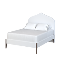 Coley Home custom upholstered bed with elegant headboard and white bedding.