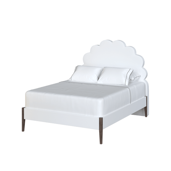 Scalloped edge bed with white upholstery from Coley Home.