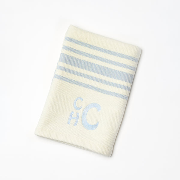 Cozy personalized striped blanket from Coley Home with monogram. Perfect for stylish home decor.