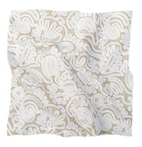 Coley Home fabric swatch with white floral pattern on beige background.