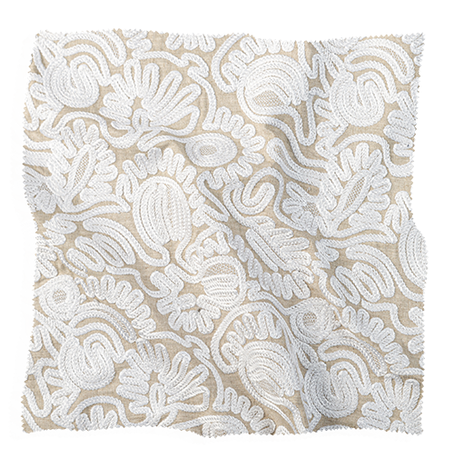 Coley Home fabric swatch with white floral pattern on beige background.