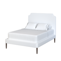 Coley Home stylish bed with white upholstered headboard and elegant design.