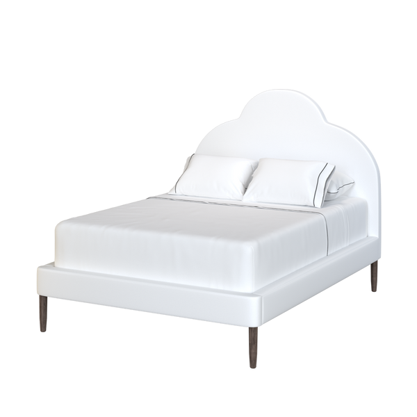 Coley Home customizable bed with scalloped headboard and plush white fabric.