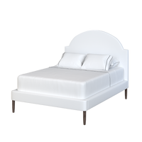 Coley Home scalloped bed frame with white fabric, elegant bedroom furniture design.
