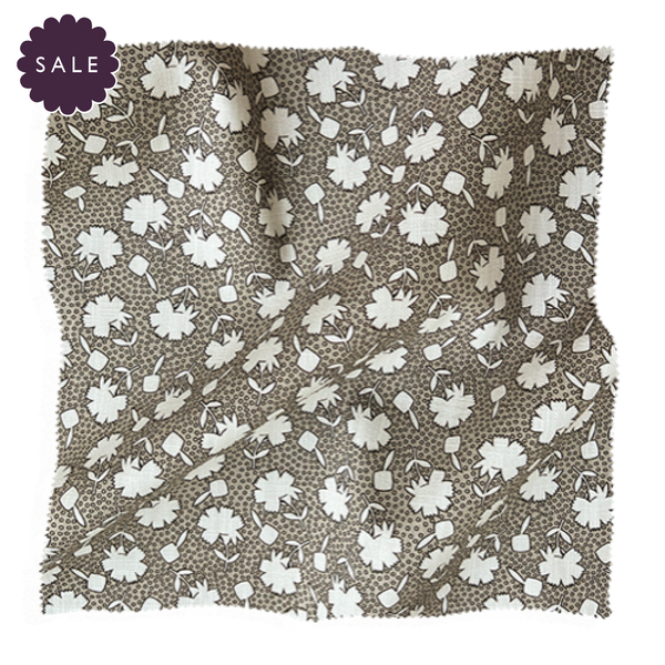 Floral fabric swatch from Coley Home in brown and white.