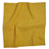 Golden fabric swatch from Coley Home, showcasing texture and color.