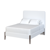 Coley Home white bed with headboard and wooden legs. Modern bedroom furniture design.